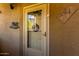 Charming front door with glass and decorative welcome sign, number displayed at 10136 E Southern Ave # 2064, Mesa, AZ 85209