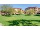 Expansive green space with mature trees and well-maintained landscaping at 10136 E Southern Ave # 2064, Mesa, AZ 85209