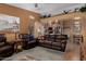 Inviting living room with leather furniture, open archway to the kitchen and unique decor at 10136 E Southern Ave # 2064, Mesa, AZ 85209