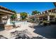 Inviting pool area with shaded seating, creating a perfect spot for relaxation at 10136 E Southern Ave # 2064, Mesa, AZ 85209