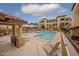 Relaxing community pool and hot tub area with comfortable lounge chairs and shaded pergola at 10136 E Southern Ave # 2064, Mesa, AZ 85209