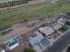 Aerial view showcases a home with a nearby greenbelt, neighboring homes, and community amenities at 119 E Hampton Ave, Mesa, AZ 85210