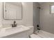 Updated bathroom with sleek fixtures and modern shower tile at 119 E Hampton Ave, Mesa, AZ 85210