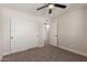 Bedroom with neutral walls, carpet, and a ceiling fan at 119 E Hampton Ave, Mesa, AZ 85210