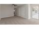 Bedroom featuring neutral carpet, ceiling fan, closet, and access to the back yard at 119 E Hampton Ave, Mesa, AZ 85210