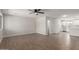 Open concept living space with wood-look tile flooring and natural light at 119 E Hampton Ave, Mesa, AZ 85210