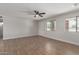 Open concept living space with wood-look tile flooring and natural light at 119 E Hampton Ave, Mesa, AZ 85210