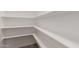Walk-in pantry with ample shelving for optimal storage at 119 E Hampton Ave, Mesa, AZ 85210