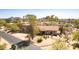 Desert home with tile roof, desert landscaping, and mountain views from aerial perspective at 1305 Coyote Pass Pass, Carefree, AZ 85377