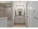 Well-lit bathroom features tile flooring, decorative tile backsplash, and ample storage space at 1305 Coyote Pass Pass, Carefree, AZ 85377