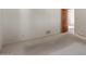 The carpeted room has a door to the carpeted hallway and is freshly painted white at 1305 Coyote Pass Pass, Carefree, AZ 85377