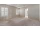 Bright bedroom with neutral carpet, white walls, and view of the bathroom through an open door at 1305 Coyote Pass Pass, Carefree, AZ 85377