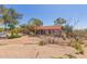 Single-story home boasts a tile roof and low-maintenance desert landscaping at 1305 Coyote Pass Pass, Carefree, AZ 85377
