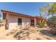 Rear of home showcasing the large patio, desert plants, and unique architecture at 1305 Coyote Pass Pass, Carefree, AZ 85377