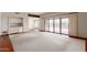 Spacious living room featuring built-in shelving and sliding glass doors to the outside patio at 1305 Coyote Pass Pass, Carefree, AZ 85377