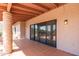 Covered patio area with brick-like pillars offering outdoor living space and tile flooring at 1305 Coyote Pass Pass, Carefree, AZ 85377