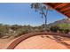 Desert landscape view from the open tiled patio of the residence at 1305 Coyote Pass Pass, Carefree, AZ 85377