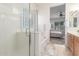 Bright bathroom featuring a glass-enclosed shower and soaking tub at 13569 S 175Th Dr, Goodyear, AZ 85338