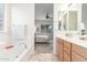 Bathroom with double sink vanity and view to the bedroom at 13569 S 175Th Dr, Goodyear, AZ 85338