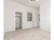 Well-lit bedroom with closet and carpet flooring at 13569 S 175Th Dr, Goodyear, AZ 85338