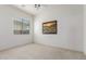 Bedroom with large windows offering natural light and carpeted flooring at 13569 S 175Th Dr, Goodyear, AZ 85338