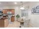 Cozy breakfast nook features a round table, pendant lighting, and neutral decor near the kitchen at 13569 S 175Th Dr, Goodyear, AZ 85338