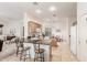 Bright kitchen featuring stainless steel appliances, an island with seating, and tile flooring at 13569 S 175Th Dr, Goodyear, AZ 85338