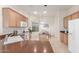 Well-lit kitchen boasts ample cabinetry, modern appliances, and a breakfast nook near the window at 13569 S 175Th Dr, Goodyear, AZ 85338