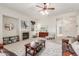 Bright living room offering plush seating, a fireplace, and an open layout into the adjacent room at 13569 S 175Th Dr, Goodyear, AZ 85338