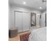 Bedroom with light-colored wood flooring and a closet with sliding doors in a well-lit space at 141 E Bonita Way, Tempe, AZ 85281
