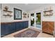 Bright dining area featuring a built-in cabinet, open shelving, and doors leading to the backyard at 141 E Bonita Way, Tempe, AZ 85281