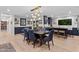 Elegant dining room with a large dining table, upholstered chairs, and stylish pendant lighting at 141 E Bonita Way, Tempe, AZ 85281