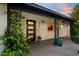 Inviting front entrance with potted plants, a brick pathway, and a stylish door to welcome you home at 141 E Bonita Way, Tempe, AZ 85281