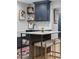 Charming kitchen with island, white marble countertops, and navy cabinets at 141 E Bonita Way, Tempe, AZ 85281