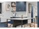Stylish kitchen featuring an island, white marble countertops, and navy blue cabinetry at 141 E Bonita Way, Tempe, AZ 85281