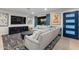 Cozy living room with a comfortable sectional sofa, a dark media console, and a decorative rug at 141 E Bonita Way, Tempe, AZ 85281
