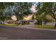 A charming single-story home with mature trees and a well-manicured front lawn on a quiet street at 141 E Bonita Way, Tempe, AZ 85281