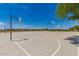 Community basketball court with multiple hoops and well-maintained surface at 14294 W Edgemont Ave, Goodyear, AZ 85395