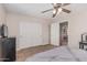 Bedroom featuring double sliding door closet, carpet, and natural light at 14294 W Edgemont Ave, Goodyear, AZ 85395