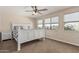 Bedroom with three sunny windows, ceiling fan and carpet at 14294 W Edgemont Ave, Goodyear, AZ 85395