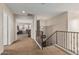 Hallway with carpet, white trim, and natural light leading to a bedroom at 14294 W Edgemont Ave, Goodyear, AZ 85395