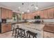 Stylish kitchen with a large island, granite countertops, and stainless steel appliances at 14294 W Edgemont Ave, Goodyear, AZ 85395