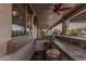 Outdoor kitchen and bar area for entertaining and relaxing by the pool at 14294 W Edgemont Ave, Goodyear, AZ 85395