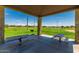 Community park featuring picnic tables, a grill, and grassy fields for recreation at 14294 W Edgemont Ave, Goodyear, AZ 85395