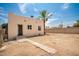 The backyard features a block wall and palm tree, with a walkway leading up to the home at 1505 W Fillmore St, Phoenix, AZ 85007