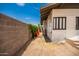View of backyard shows exterior of home with dirt landscaping at 1505 W Fillmore St, Phoenix, AZ 85007