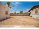 View of backyard shows exterior of home with dirt landscaping at 1505 W Fillmore St, Phoenix, AZ 85007