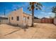 View of backyard shows exterior of home with dirt landscaping at 1505 W Fillmore St, Phoenix, AZ 85007