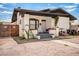 Charming home featuring a stucco exterior, covered porch, and low-maintenance gravel landscaping at 1505 W Fillmore St, Phoenix, AZ 85007