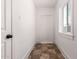 Hallway with tile flooring, bright natural light, and white walls, creating a welcoming space at 1505 W Fillmore St, Phoenix, AZ 85007